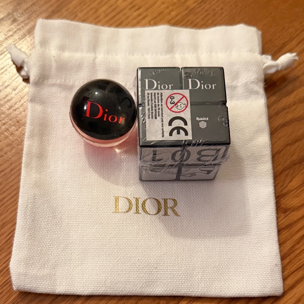 Dior Promotional Rubik’s cube and bouncy ball in the pouch.